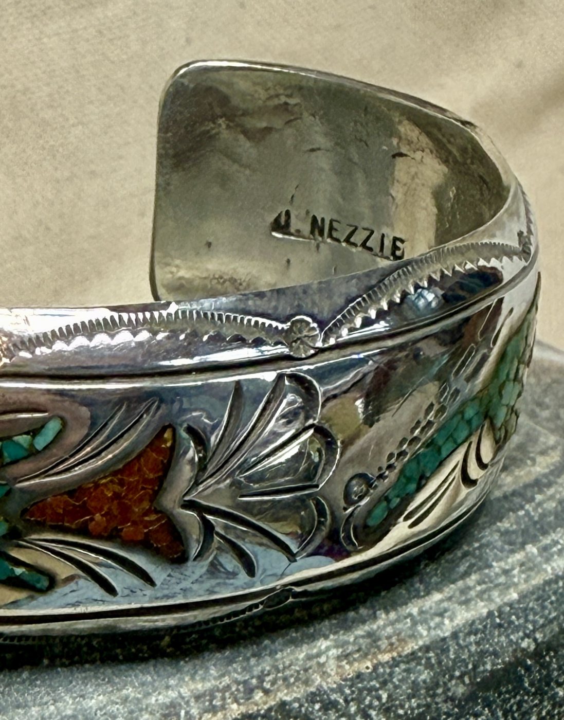 Close-up of the maker's stamp inside the silver cuff